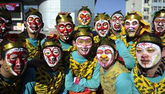 Performers play Dongyao Macha for year of monkey, N China